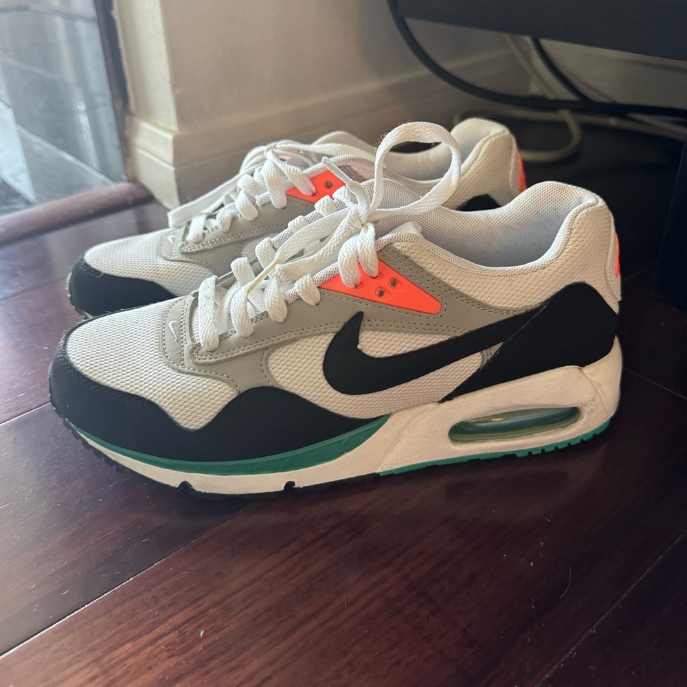 Nike Air Max 1 Retro trainers in white, black, and orange #AirMax